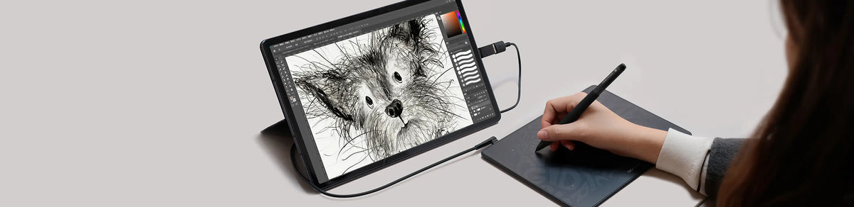 Digital artist using DIGIDRAW Drawing Tablet to sketch a black and white dog portrait, ideal for illustration and creative work.