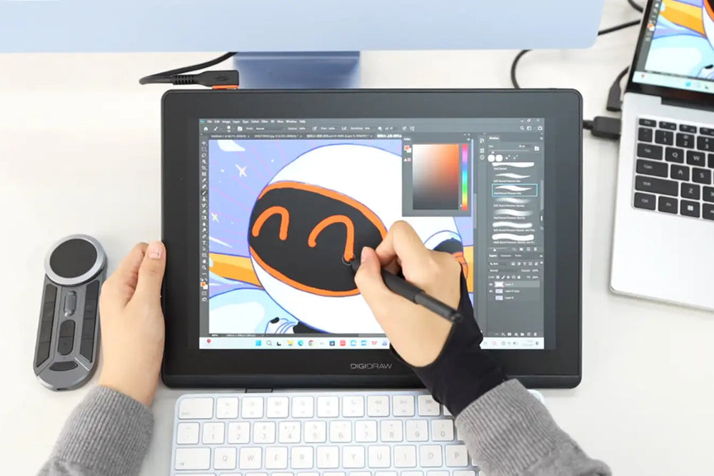 Artist wearing a drawing glove painting a cute character on the portable DIGIDRAW Turing 14 pen display.