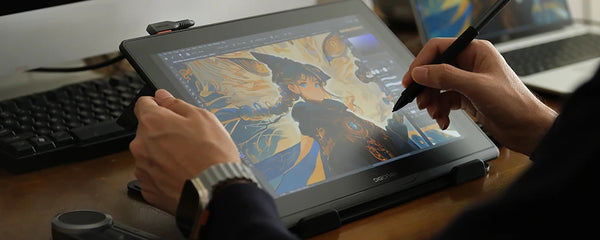 Artist hands drawing on DIGIDRAW Turing 14 pen display in a real working environment.